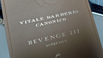 Vitale Barberis Canonico (VBC) Fabric Swatch Book: A professional tailor's tool used to select authentic Italian wool suiting with verified mill pedigree.