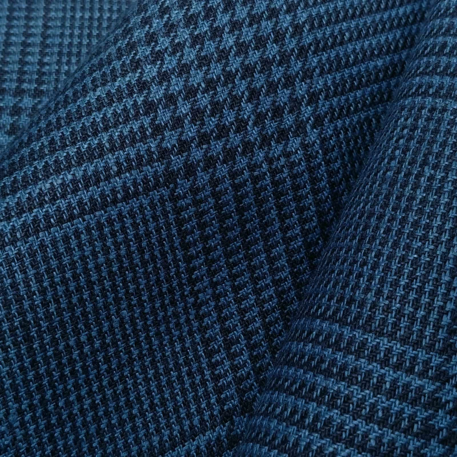 Dark blue check linen suiting fabric, close-up showing crisp structured weave and soft hand feel, premium breathable linen ideal for tailored jackets, summer suits, and refined business casual menswear.
