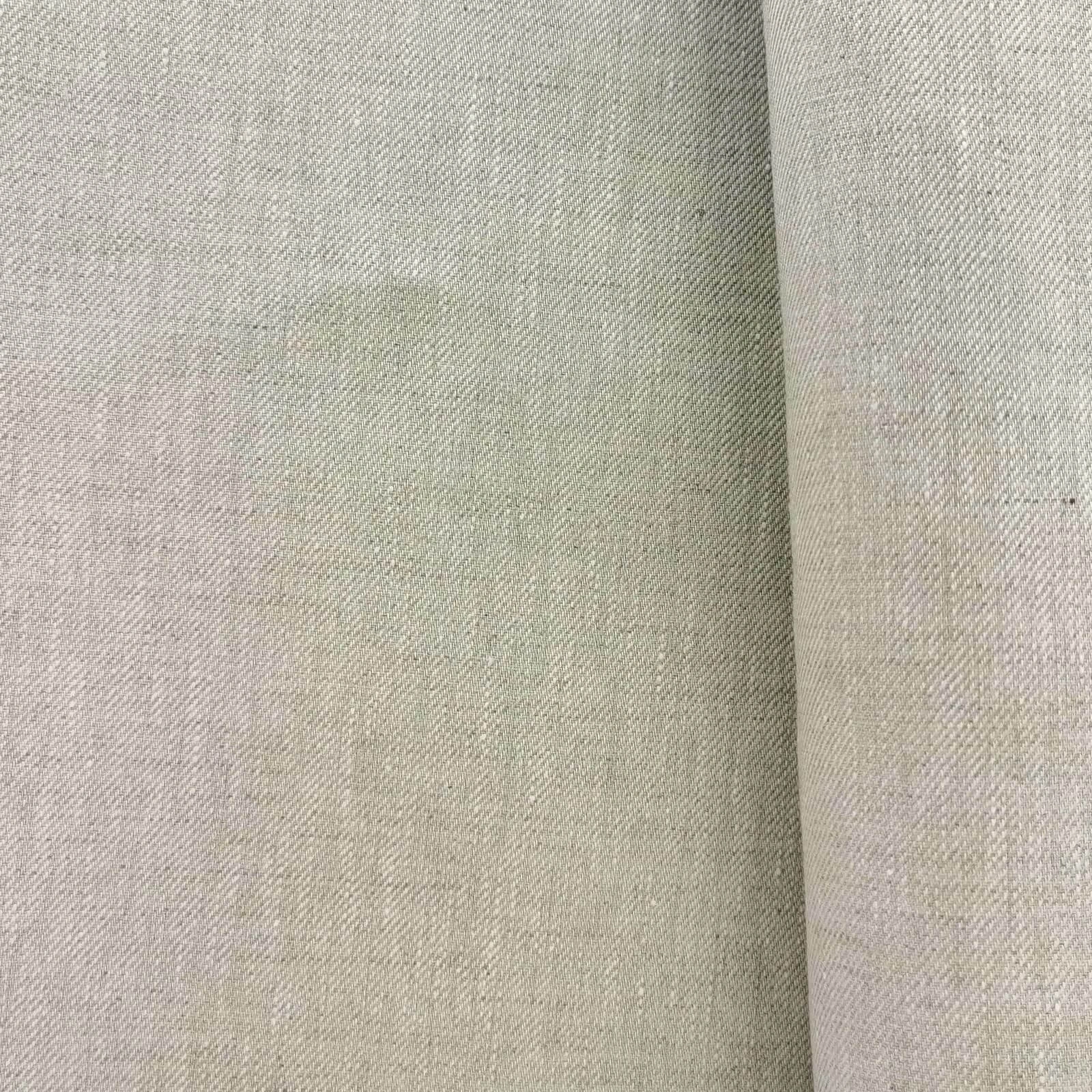 Natural ecru yarn-dyed linen suiting fabric close-up with subtle twill weave and mélange texture, crisp structure and soft hand feel, premium breathable linen ideal for summer suits, tailored jackets, and elegant menswear styling.