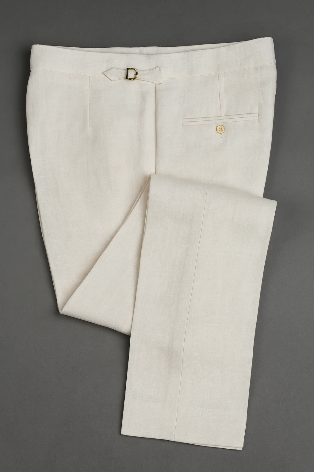 Riviera Stroll bespoke trousers in breathable Irish Baird McNutt linen featuring handcrafted side adjusters and a clean, belt-less waistband.
